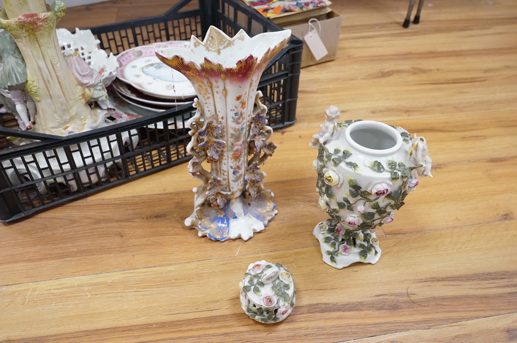 A German porcelain figural centrepiece, lobed dish, three other plates and two others